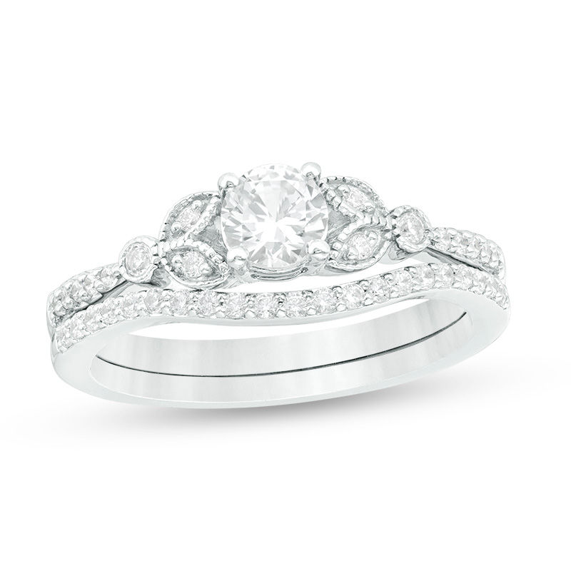 4.5mm Lab-Created White Sapphire and 0.17 CT. T.W. Diamond Leaf-Sides Vintage-Style Bridal Set in Sterling Silver