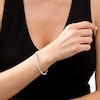 Thumbnail Image 1 of 0.086 CT. T.W. Diamond Love Knot Tennis Bracelet in Sterling Silver - 7.5"