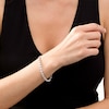 Thumbnail Image 2 of 0.086 CT. T.W. Diamond Love Knot Tennis Bracelet in Sterling Silver - 7.5"
