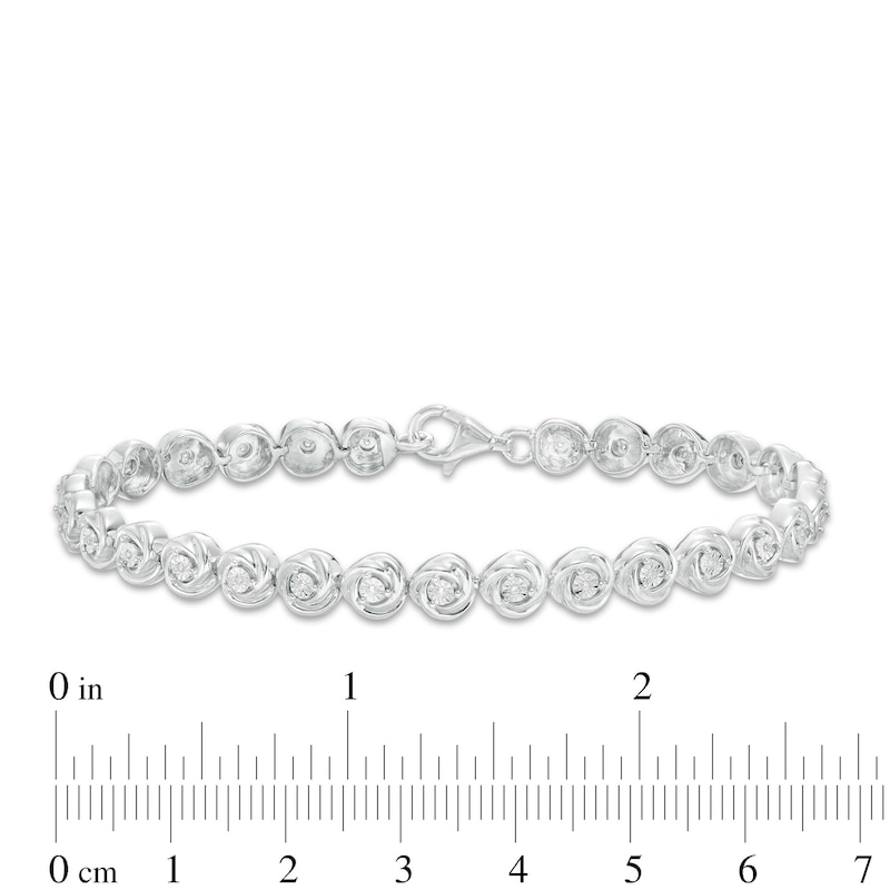 0.086 CT. T.W. Diamond Love Knot Tennis Bracelet in Sterling Silver - 7.5"