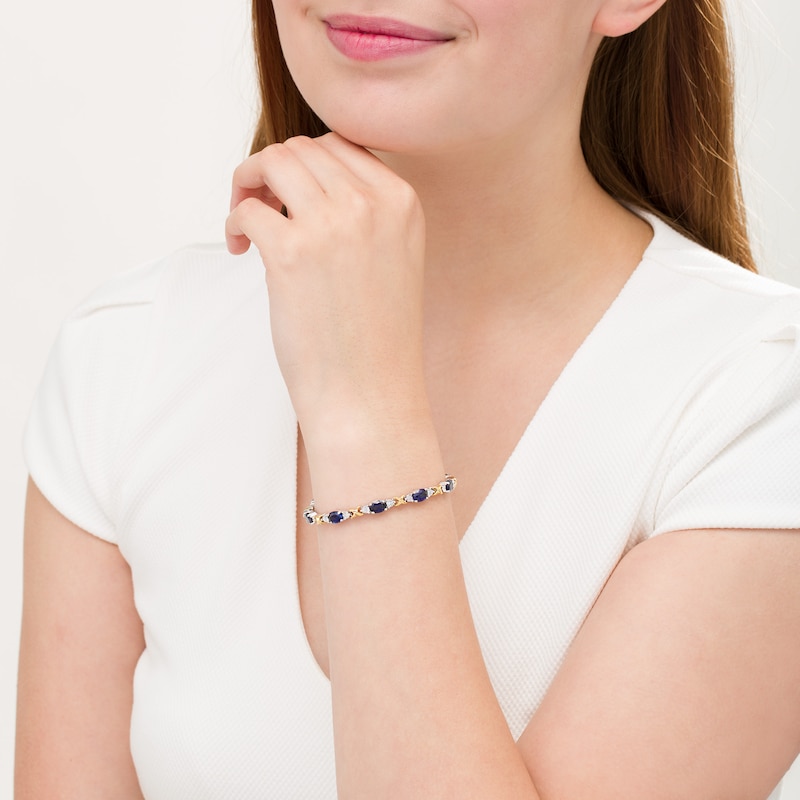 Oval Lab-Created Blue Sapphire and 0.086 CT. T.W. Diamond "X" Bracelet in Sterling Silver and 14K Gold Plate - 7.25"