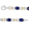 Thumbnail Image 2 of Oval Lab-Created Blue Sapphire and 0.086 CT. T.W. Diamond "X" Bracelet in Sterling Silver and 14K Gold Plate - 7.25"