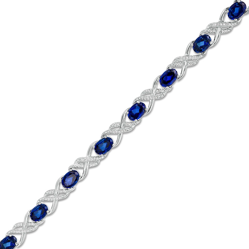 Oval Lab-Created Blue Sapphire and 0.23 CT. T.W. Diamond Double Infinity Bracelet in Sterling Silver - 7.25"