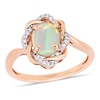 Thumbnail Image 0 of Oval Opal and 0.08 CT. T.W. Diamond Twist Frame Ring in 10K Rose Gold