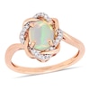 Thumbnail Image 1 of Oval Opal and 0.08 CT. T.W. Diamond Twist Frame Ring in 10K Rose Gold