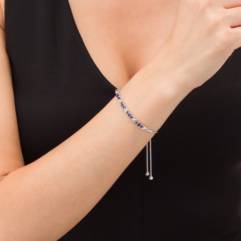 Lab-Created Blue Sapphire and 0.065 CT. T.W. Diamond Three Stone "X" and "O" Bolo Bracelet in Sterling Silver - 9.5"