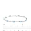 Thumbnail Image 1 of Oval Swiss Blue Topaz and Diamond Accent Wave Link Bracelet in Sterling Silver - 7.25"