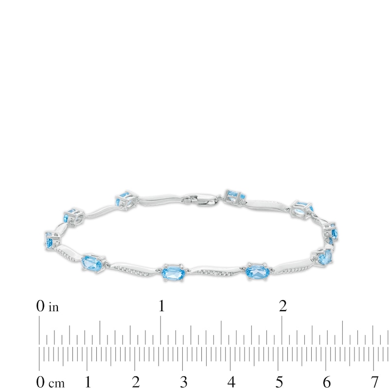 Oval Swiss Blue Topaz and Diamond Accent Wave Link Bracelet in Sterling Silver - 7.25"