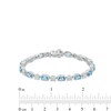 Thumbnail Image 1 of Emerald-Cut Swiss Blue Topaz and 0.06 CT. T.W. Diamond Link Bracelet in Sterling Silver - 7.25"