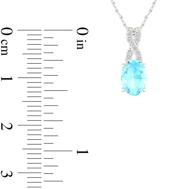 Oval Aquamarine and 0.04 CT. T.W. Diamond "X" Drop Pendant in 10K White Gold