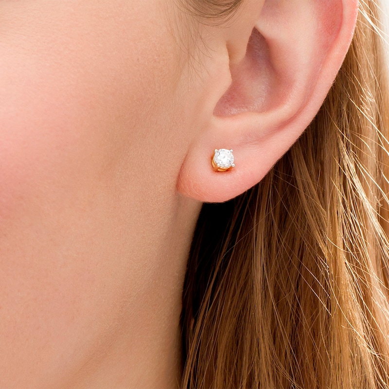 Main Image 2 of 0.69 CT. T.W. Diamond Solitaire Stud Earrings in 14K Gold