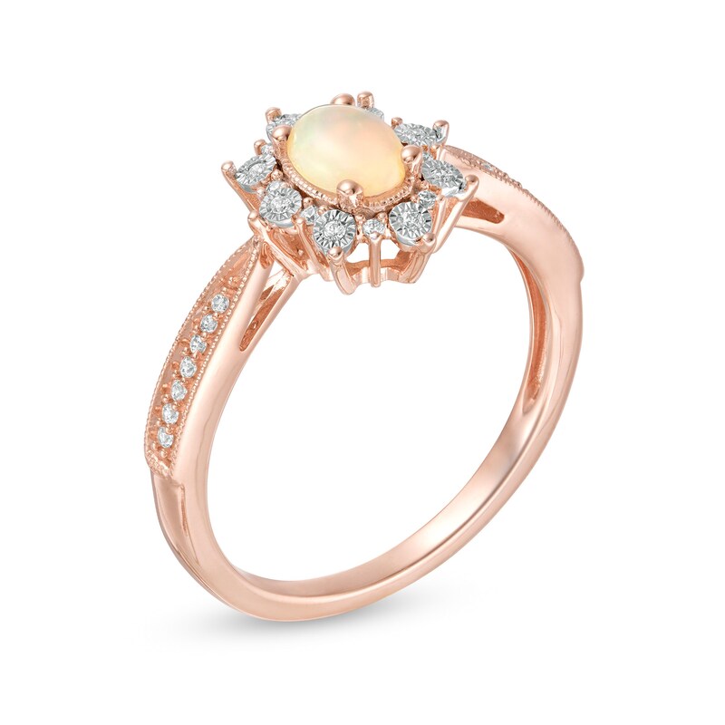 Main Image 3 of Oval Opal and 0.10 CT. T.W. Diamond Sunburst Frame Vintage-Style Tapered Shank Ring in 10K Rose Gold