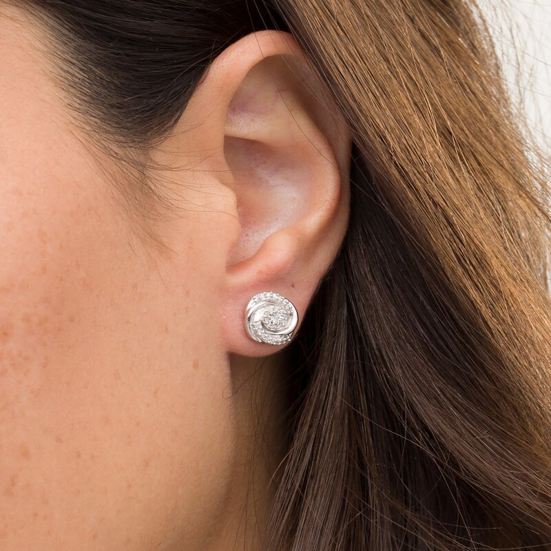 Main Image 2 of 0.145 CT. T.W. Composite Diamond Swirl Stud Earrings in 10K White Gold