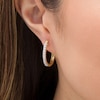 Thumbnail Image 1 of 0.50 CT. T.W. Diamond Oval Hoop Earrings in 10K Gold