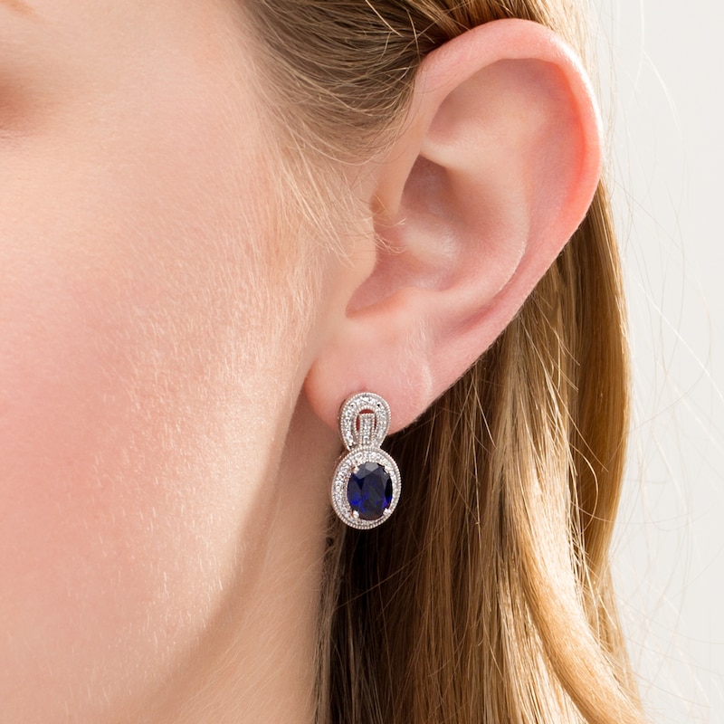Oval Lab-Created Blue Sapphire and 0.115 CT. T.W. Diamond Frame Vintage-Style Buckle Drop Earrings in Sterling Silver