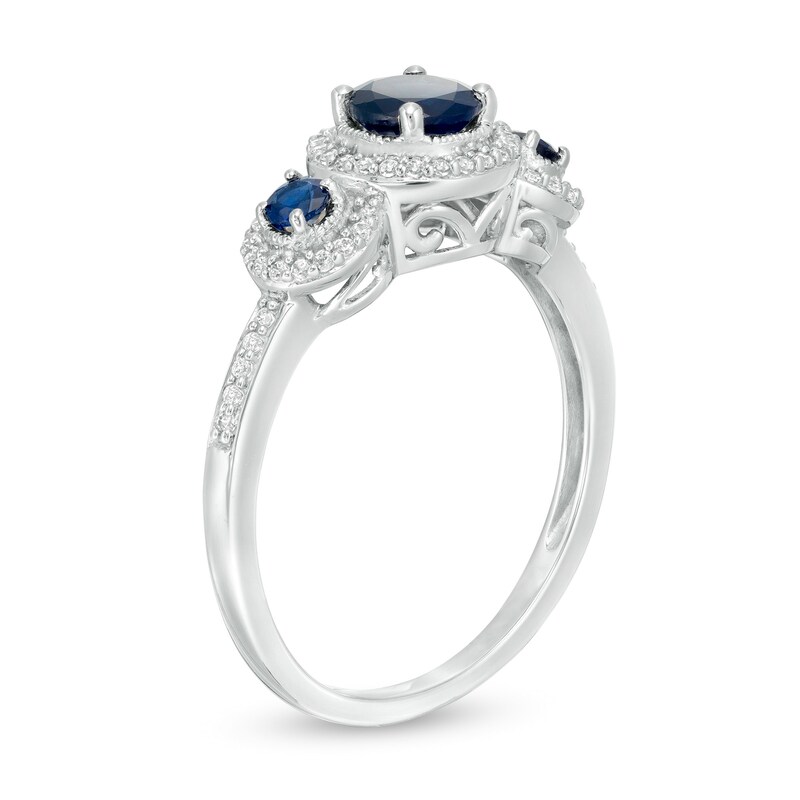 Blue Sapphire and 0.15 CT. T.W. Diamond Frame Three Stone Ring in 10K White Gold