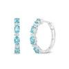 Thumbnail Image 0 of Oval Swiss Blue Topaz and Lab-Created White Sapphire Hoop Earrings in Sterling Silver