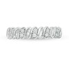 0.12 CT. T.W. Baguette and Round Diamond Stackable Spiral Anniversary Ring in 10K White Gold