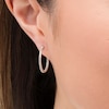Thumbnail Image 1 of 0.25 CT. T.W. Diamond Inside-Out Hoop Earrings in Sterling Silver