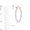 Thumbnail Image 2 of 0.25 CT. T.W. Diamond Inside-Out Hoop Earrings in Sterling Silver with 10K Rose Gold Plate
