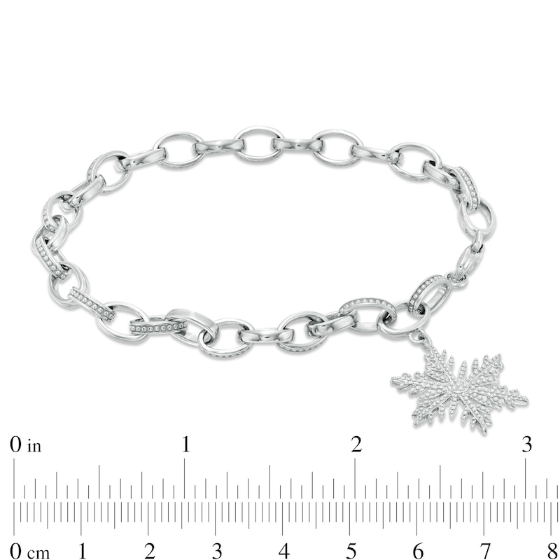0.085 CT. T.W. Diamond Snowflake Charm Bracelet in Sterling Silver - 7.5"