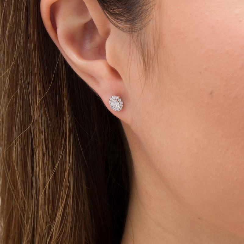 0.45 CT. T.W. Oval Certified Diamond Frame Stud Earrings in 14K White Gold (I/SI2)