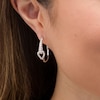 Thumbnail Image 2 of Love + Be Loved 0.50 CT. T.W. Diamond Interlocking Loop Hoop Earrings in 10K White Gold
