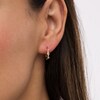 Thumbnail Image 2 of Cubic Zirconia Three Stone Twisted Loose Braid Huggie Hoop Earrings in 14K Gold