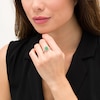 Oval Emerald and 0.25 CT. T.W. Diamond Scallop Frame Split Shank Ring in 10K Gold
