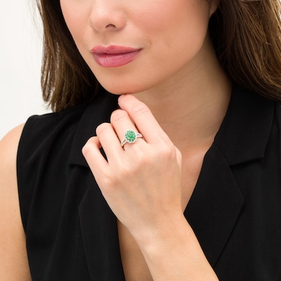 Oval Emerald and 0.25 CT. T.W. Diamond Scallop Frame Split Shank Ring in 10K Gold