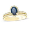 Thumbnail Image 1 of Oval Sapphire and 0.33 CT. T.W. Diamond Frame Bridal Set in 14K Gold