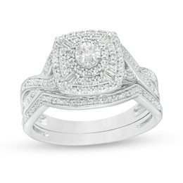 0.24 CT. T.W. Diamond Cushion and Round Triple Frame Twist Shank Bridal Set in Sterling Silver