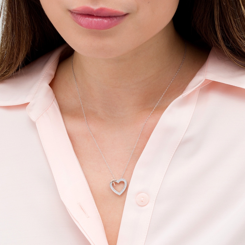 0.118 CT. T.W. Diamond Heart with Cross Necklace in Sterling Silver and 10K Rose Gold