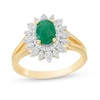 Thumbnail Image 0 of Oval Emerald and 0.20 CT. T.W. Diamond Flower Frame Split Shank Ring in 10K Gold