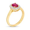 Thumbnail Image 2 of Oval Ruby and 0.20 CT. T.W. Baguette and Round Diamond Starburst Frame Ring in 10K Gold
