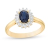Thumbnail Image 1 of Oval Blue Sapphire and 0.20 CT. T.W. Baguette and Round Diamond Starburst Frame Ring in 10K Gold