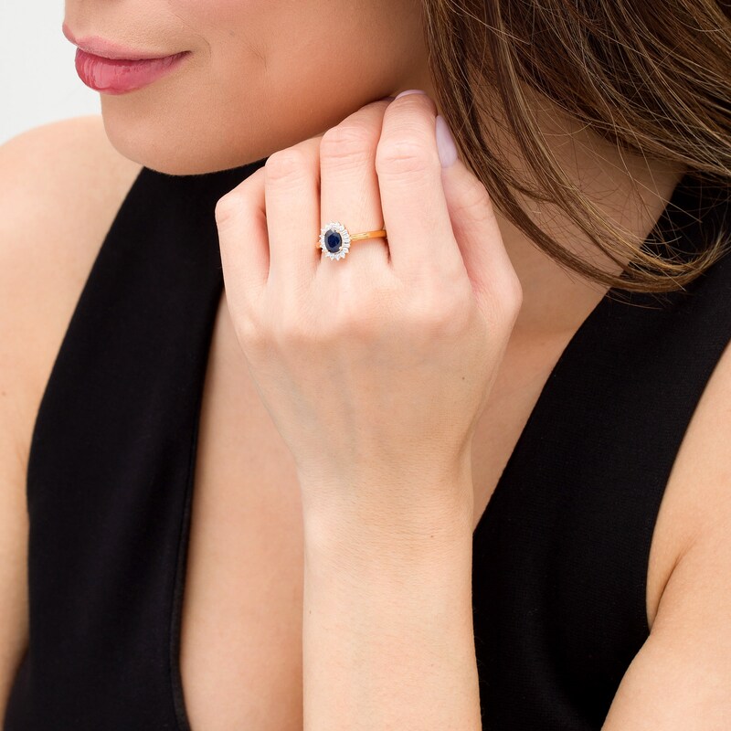 Main Image 2 of Oval Blue Sapphire and 0.20 CT. T.W. Baguette and Round Diamond Starburst Frame Ring in 10K Gold