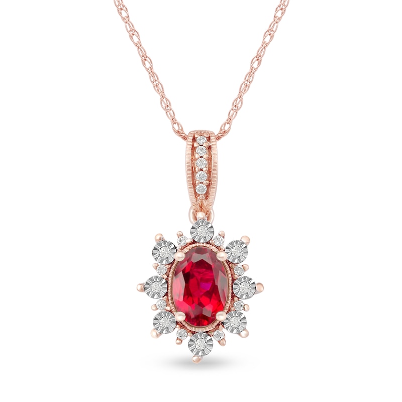 Oval Ruby and 0.08 CT. T.W. Diamond Sunburst Frame Vintage-Style Drop Pendant in 10K Rose Gold