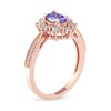 Thumbnail Image 1 of Oval Tanzanite and 0.10 CT. T.W. Diamond Sunburst Frame Vintage-Style Tapered Shank Ring in 10K Rose Gold