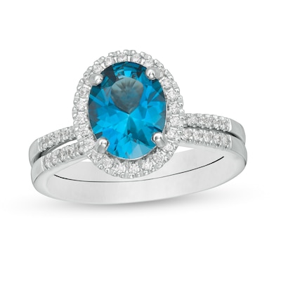 Oval London Blue Topaz and 0.31 CT. T.W. Diamond Frame Bridal Set in 14K White Gold
