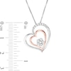 0.09 CT. T.W. Composite Diamond Double Tilted Heart Pendant in Sterling Silver with 10K Rose Gold Plate