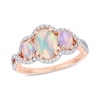 Thumbnail Image 1 of Oval Cabochon Opal and 0.31 CT. T.W. Diamond Frame Three Stone Twist Shank Ring in 10K Rose Gold