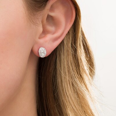0.145 CT. T.W. Composite Diamond Oval Swirl Frame Stud Earrings in 10K Gold