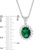 Oval Lab-Created Emerald and White Sapphire Starburst Frame Pendant in Sterling Silver