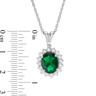 Oval Lab-Created Emerald and White Sapphire Starburst Frame Pendant in Sterling Silver