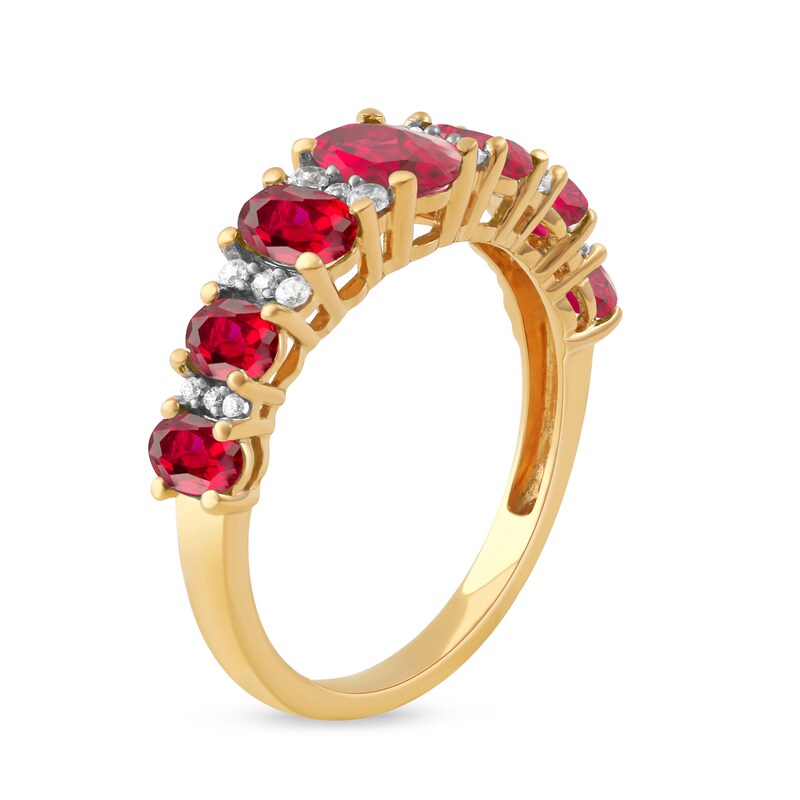 Main Image 2 of Oval Ruby and 0.15 CT. T.W. Diamond Graduated Seven Stone Alternating Trios Ring in 10K Gold