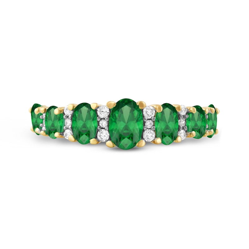 Oval Emerald and 0.13 CT. T.W. Diamond Graduated Seven Stone Alternating Trios Ring in 10K Gold