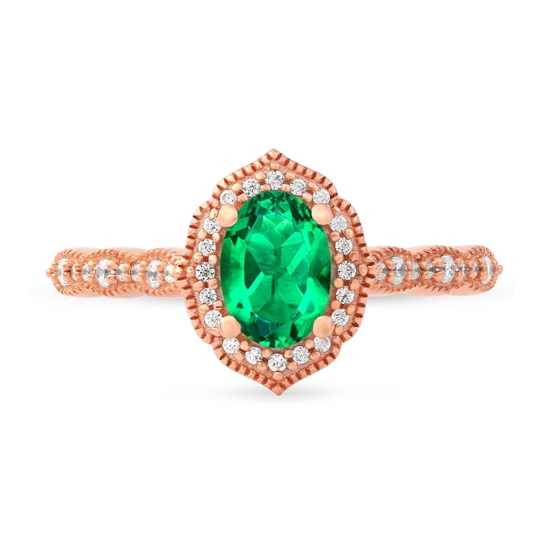 Oval Emerald and 0.16 CT. T.W. Diamond Quatrefoil Frame Vintage-Style Ring in 10K Rose Gold