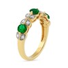 Thumbnail Image 1 of 4.0mm Emerald and 0.10 CT. T.W. Diamond Leaf Accents Vintage-Style Three Stone Ring in 10K Gold