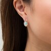 Thumbnail Image 1 of EFFY™ Collection Oval Opal and 0.30 CT. T.W. Diamond Frame Interlocking Drop Earrings in 14K Rose Gold